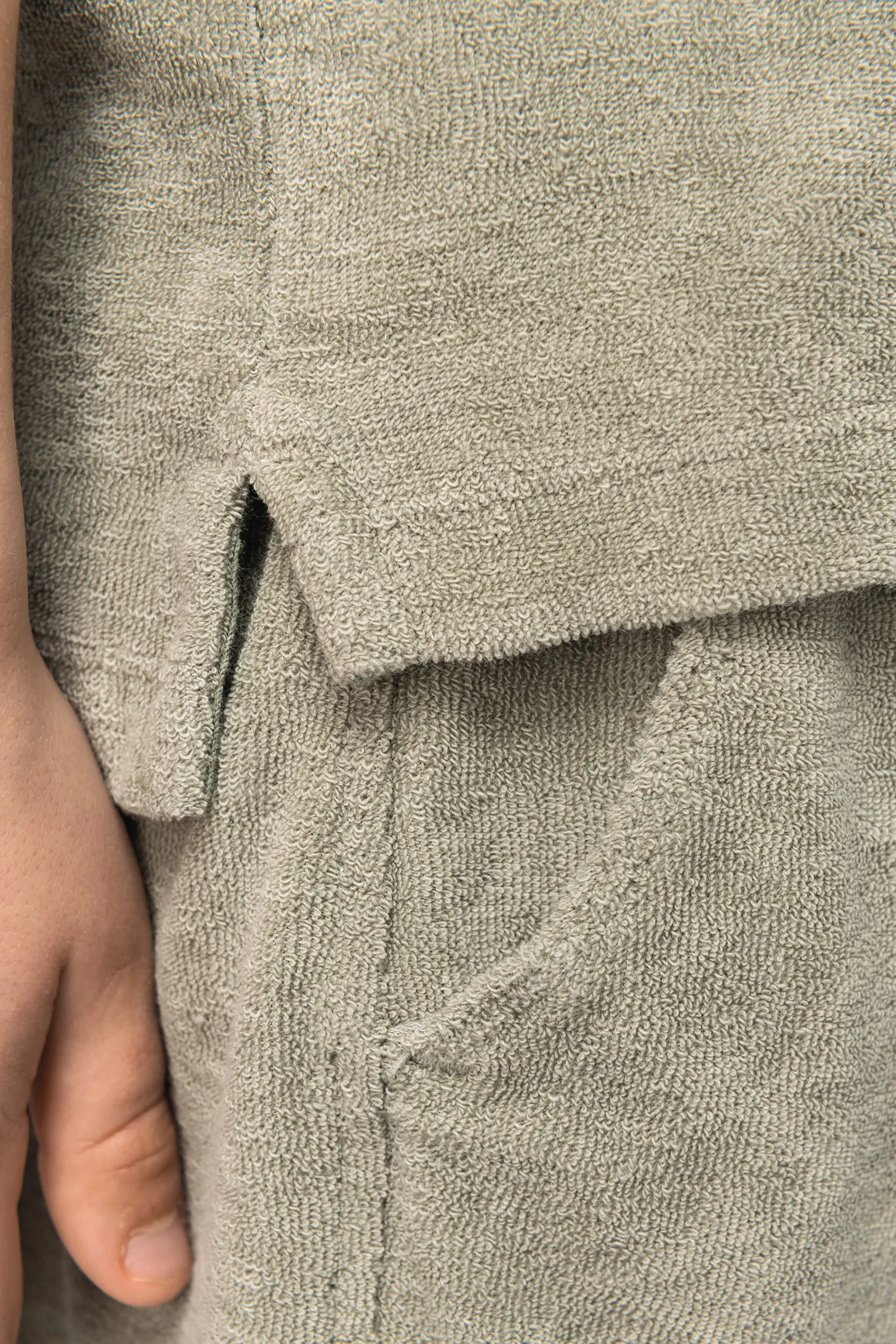 Polo ecorresponsable de rizo niño