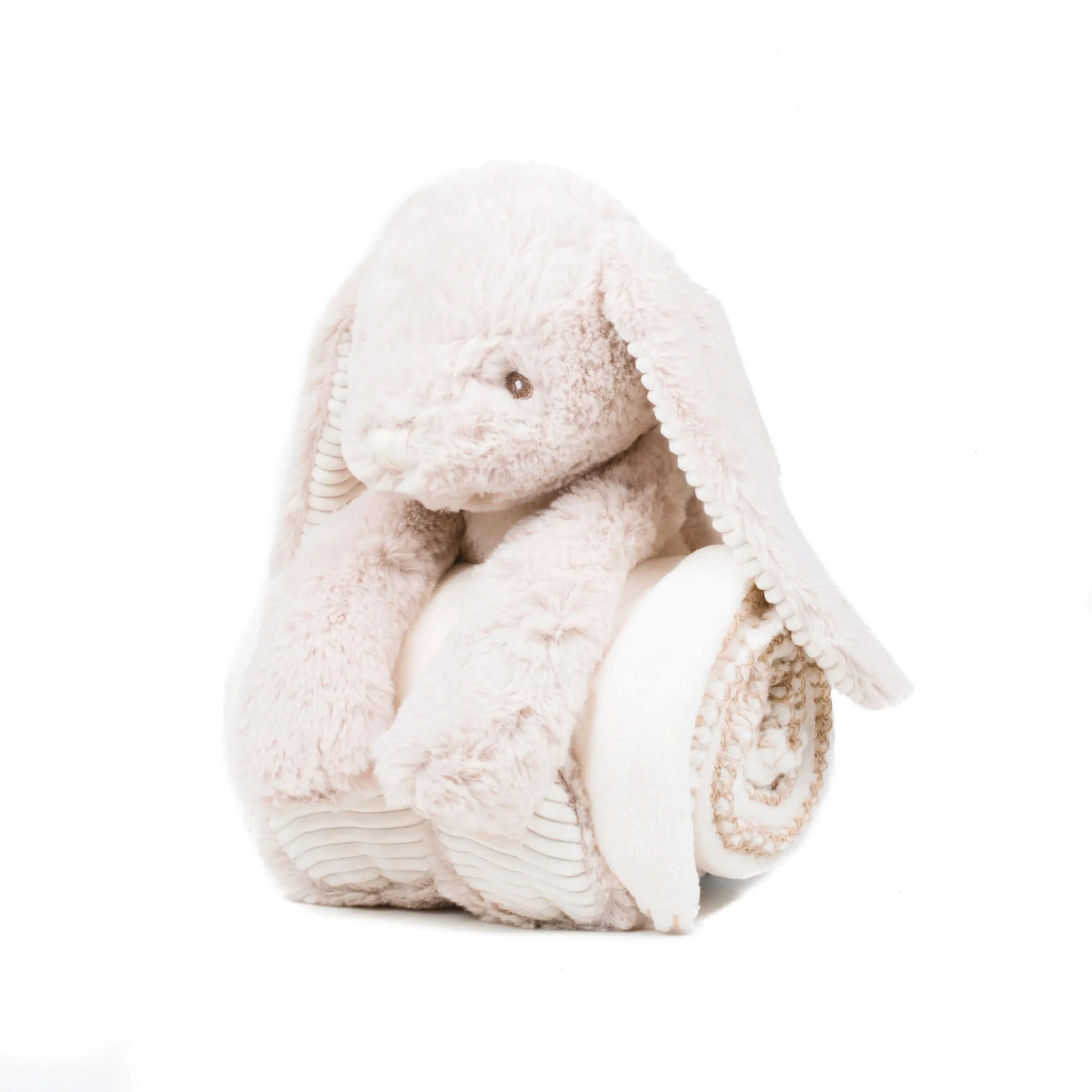 Conejo de peluche y manta
