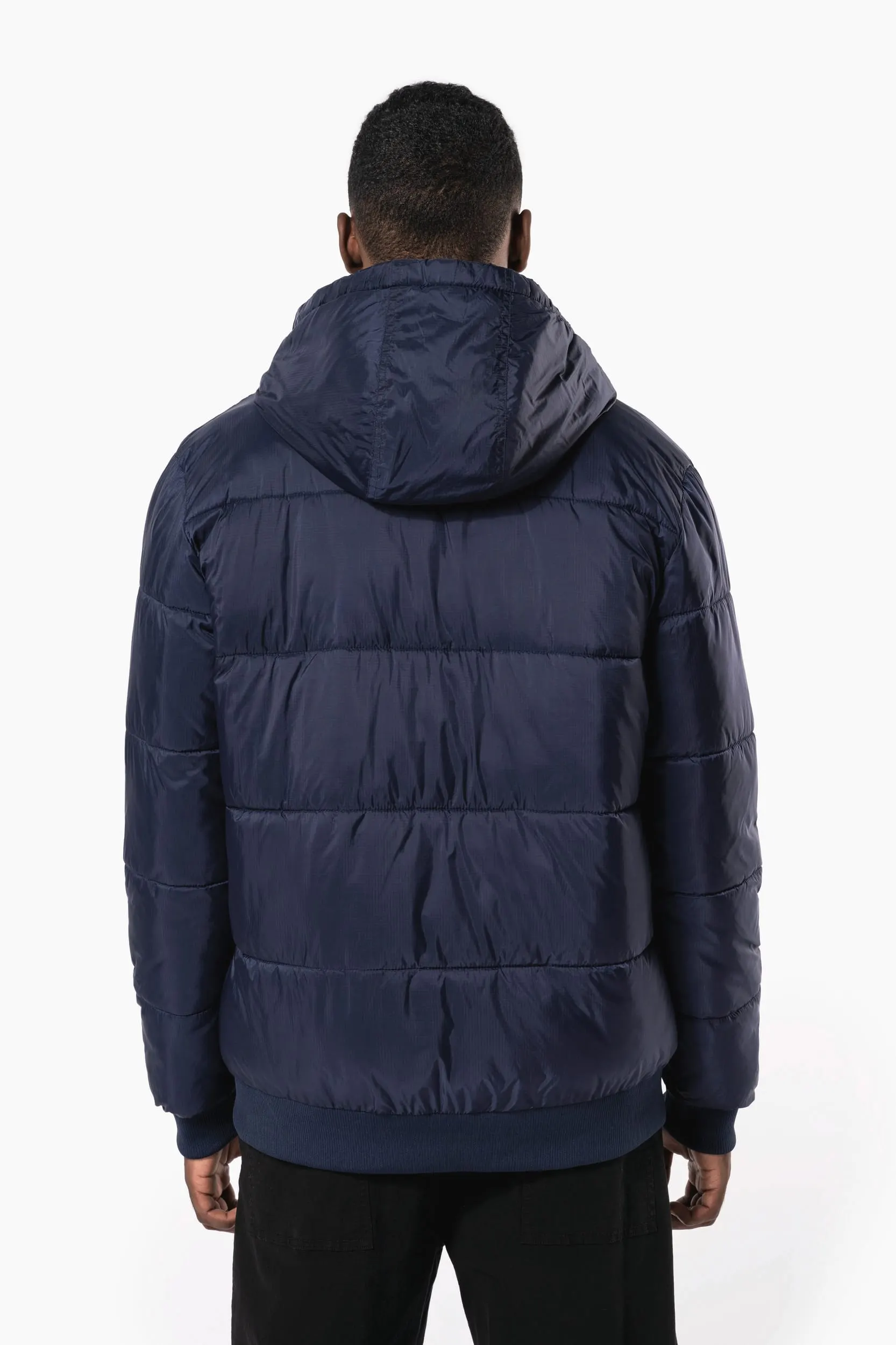 Chaqueta ripstop reciclada con capucha unisex