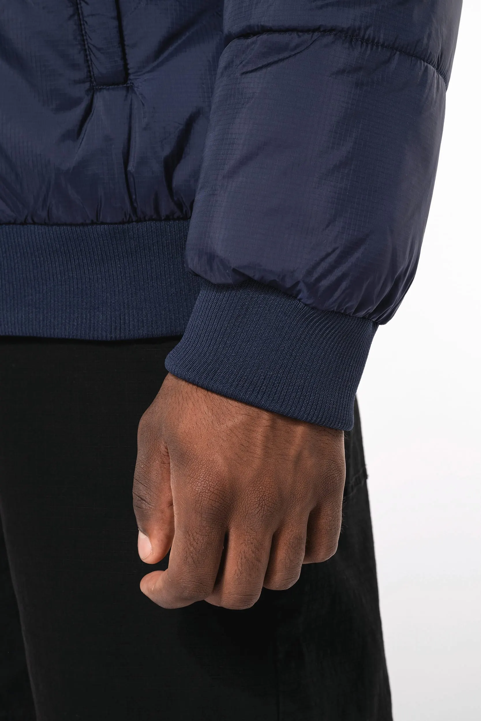 Chaqueta ripstop reciclada con capucha unisex