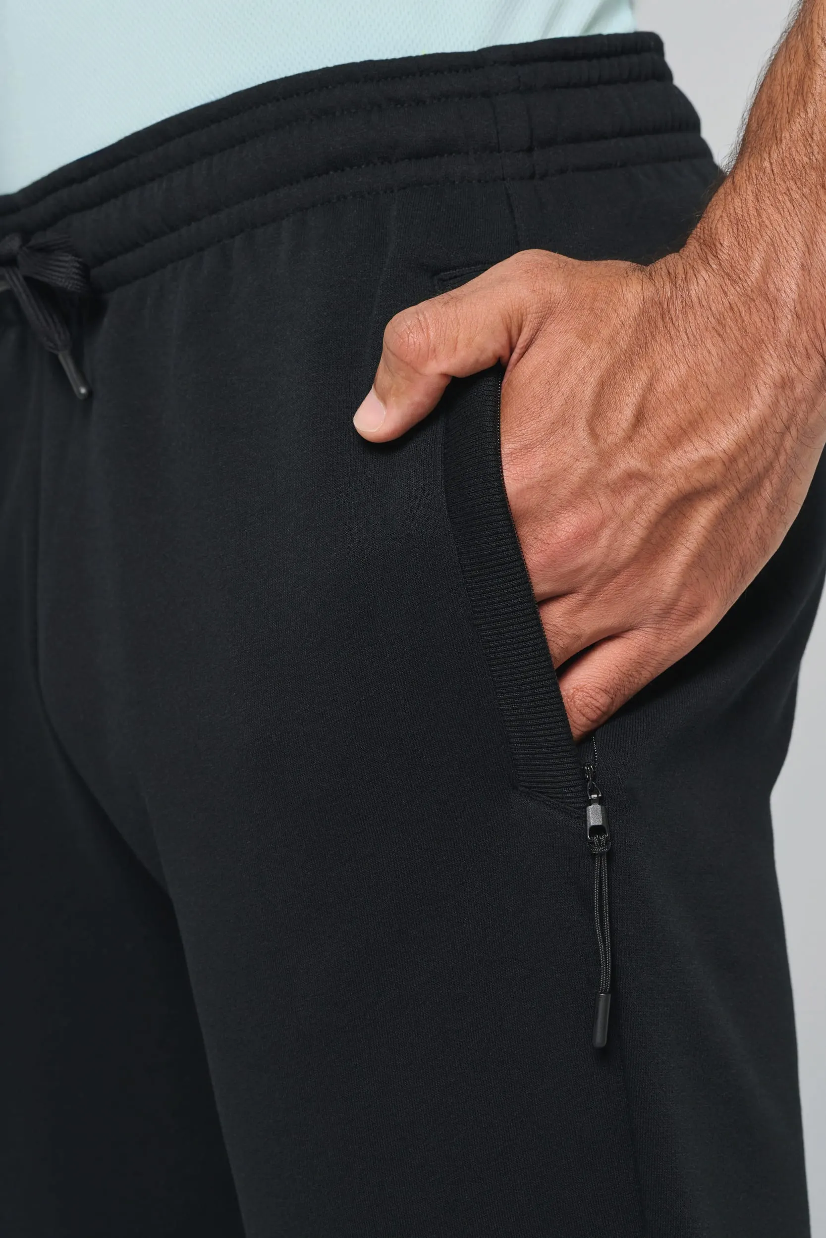 Pantalón de chándal multideporte con bolsillos adulto