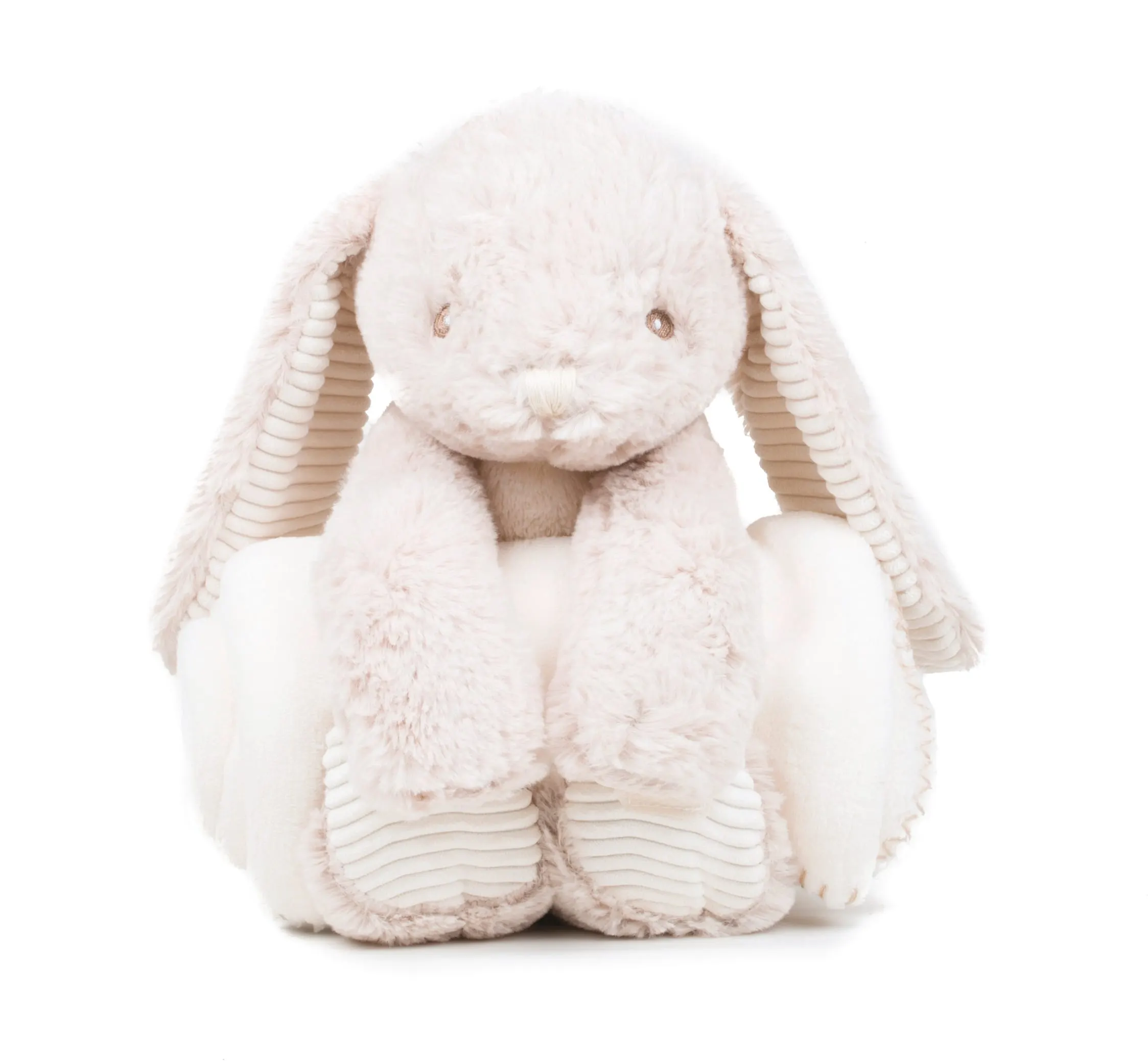 Conejo de peluche y manta