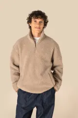 Sudadera de sherpa con 1/4 de cremallera y hombros caídos unisex